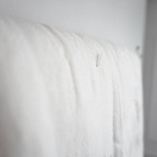 close up of white linen quilt