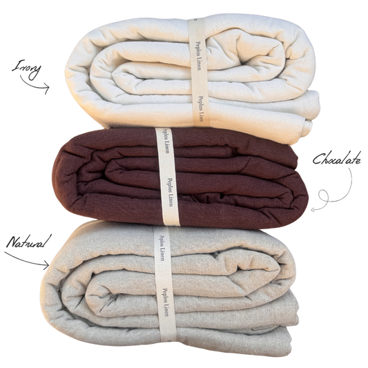 3 folded linen quilts in three colors ivory, natural and chocolate