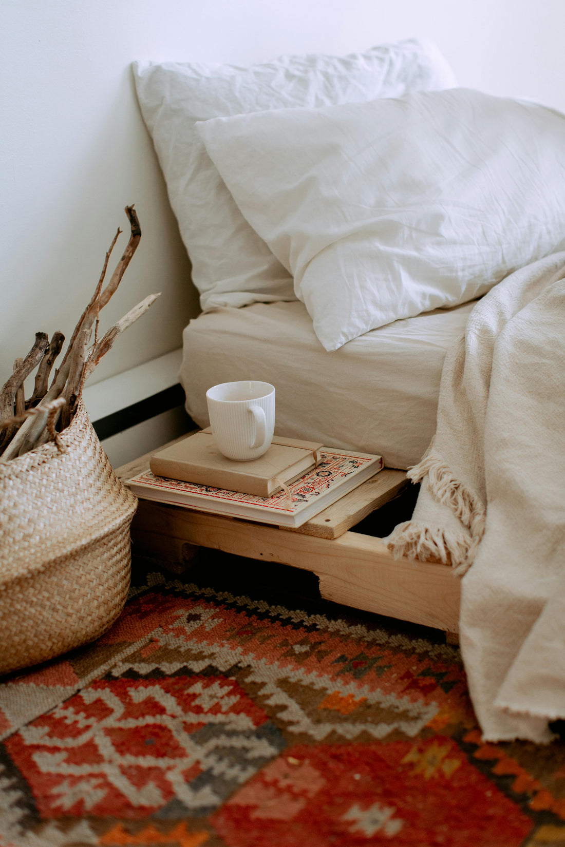 Undone linen bedding draped over an unmade bed, showcasing soft wrinkles, breathable texture, and natural light—evoking comfort, simplicity, and lived-in elegance.