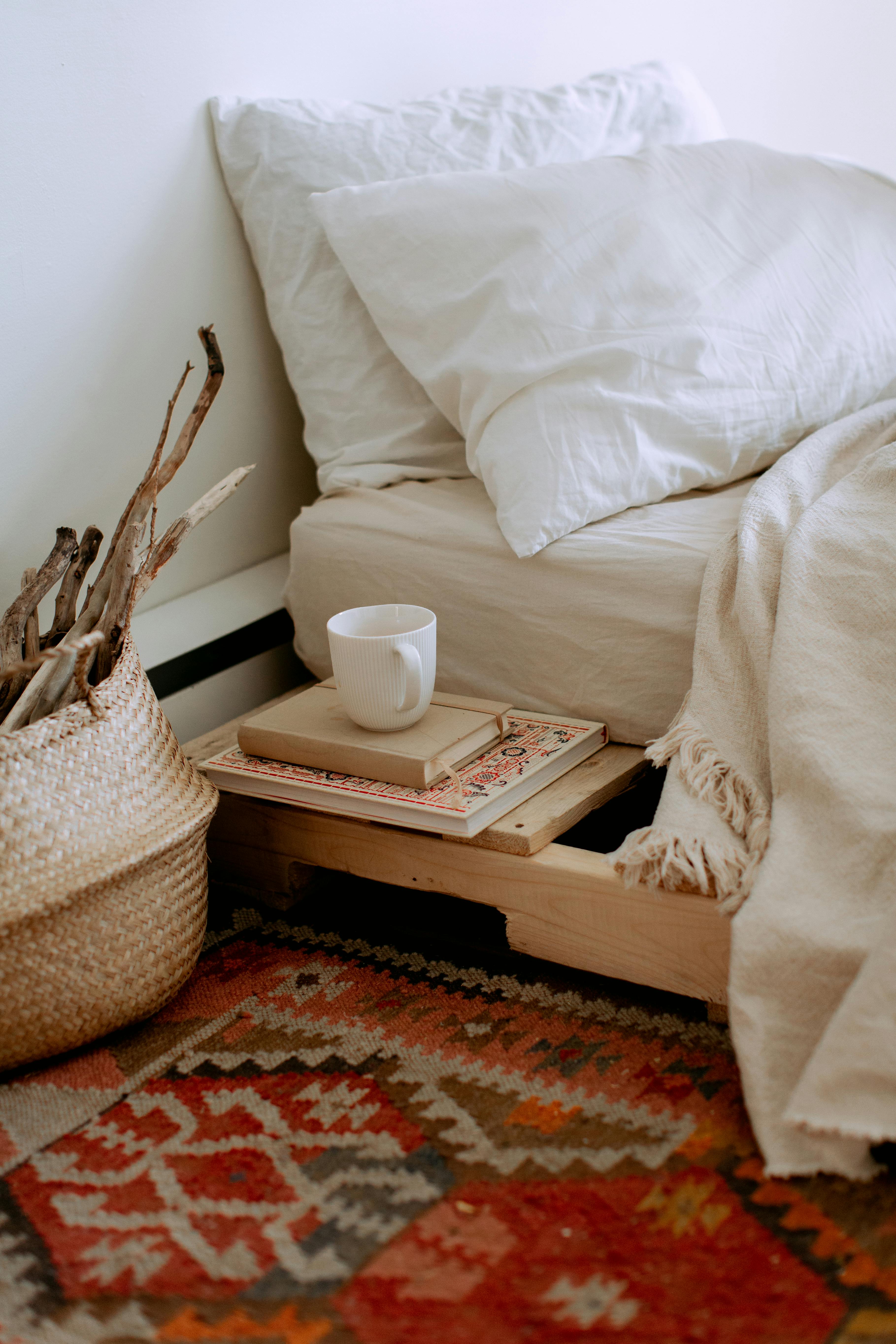 Undone linen bedding draped over an unmade bed, showcasing soft wrinkles, breathable texture, and natural light—evoking comfort, simplicity, and lived-in elegance.