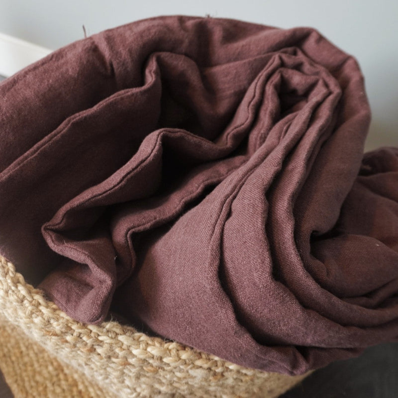 Chocolate brown handmade linen quilt with textured stone-washed linen fabric.